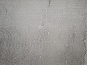 Abbildung Betonwand Fläche - zum Aufzeigen vom Poren- und Lunkerschluss des thixotropen Materials